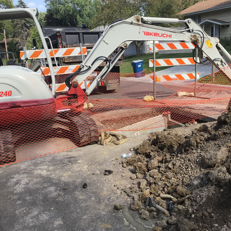 excavator repairing street